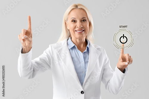 Mature businesswoman using ...