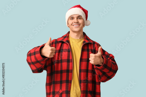 Handsome young man in Santa...