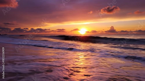 Vibrant ocean sunset with reflective water and colorful sky