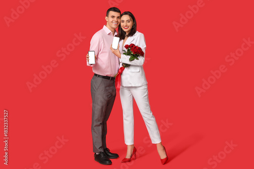 Young couple with mobile ph...