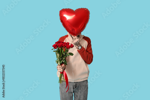 Man with bouquet of roses a...