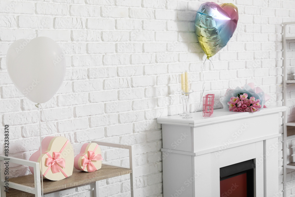 Fototapeta premium Interior of modern living room with fireplace and decorations for Valentine's Day celebration