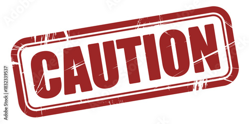 A red rubber stamp imprint that says "CAUTION" in white capital letters.