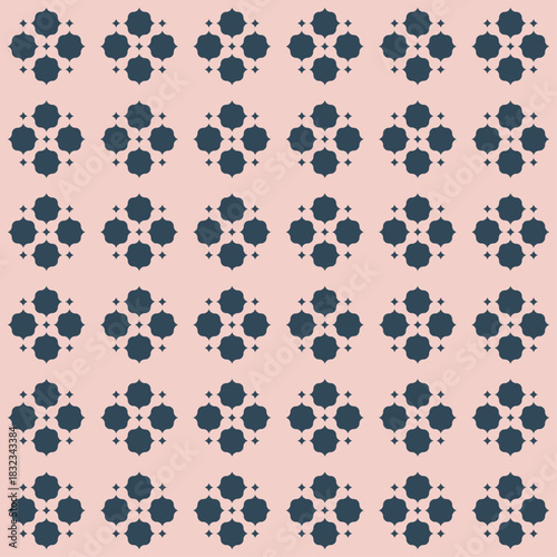 Chic seamless geometric pattern with small navy blue quatrefoil motifs clustered in repeating diamond grid layout on solid blush pink background. It has a modern Moroccan tile inspired feel. Vector