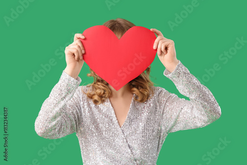 Young woman with red paper ...