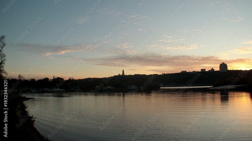Naklejka premium sunset over the river
