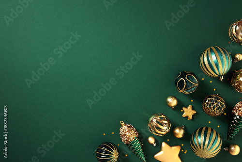 Luxury gold Christmas decorations on dark green background. Xmas greeting card template, Happy New Year banner mockup