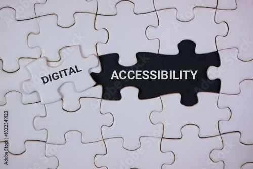 A close-up of interlocking puzzle pieces highlighting digital accessibility. The black piece labeled ACCESSIBILITY and a white piece labeled DIGITAL, symbolizing inclusive technology and design.