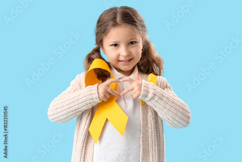 Cute little girl with yello...