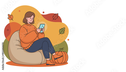 Cozy fall leisure Woman uses smartphone on a beanbag chair near a decorative pumpkin
