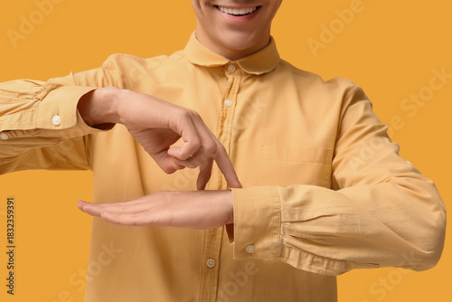 Young deaf mute man using s...
