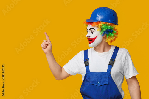 Young man as clown in jumps...