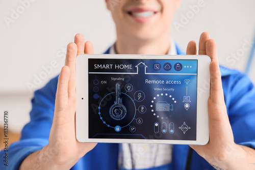 Man holding tablet with sma...
