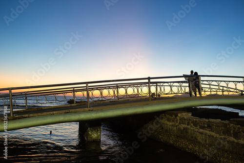 Sunset view on the footbridge at Canal 5 in Santos, Brazil