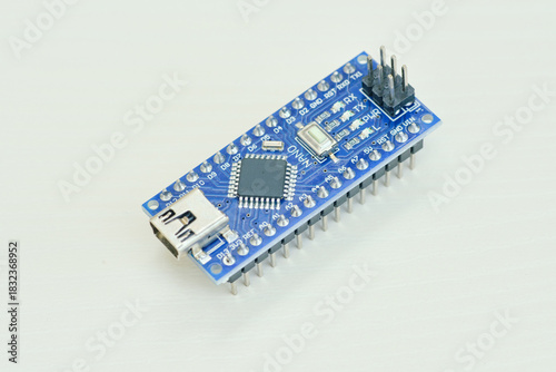 Programming board of Arduino UNO in blue colour isolated in white background