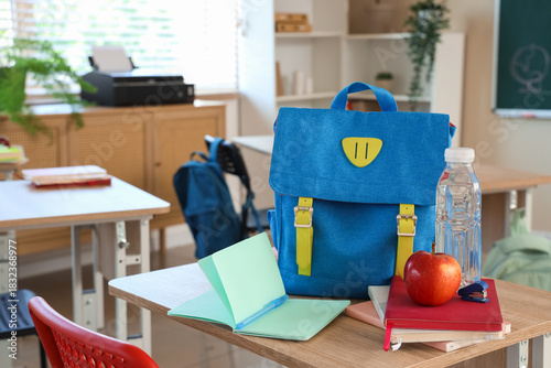 Blue backpack with apple, w...