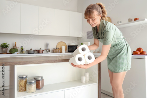 Young woman with rolls of p...