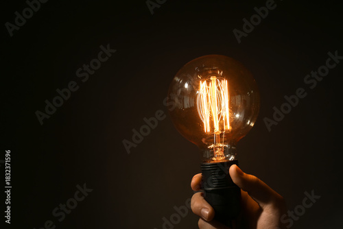 Vintage light bulb on black...