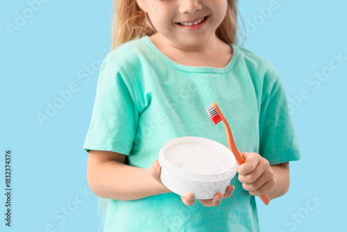 Cute little girl with tooth...