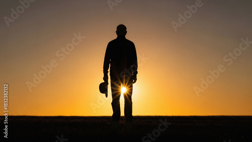 Veterans Day concept with silhouette of senior man watching sunrise outside