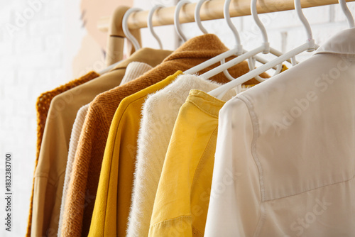Rack with autumn clothes ne...