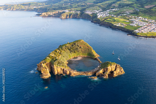 Aerial view of the volcanic islet of Vila Franca do Campo, small island with circle crater lake, Azores coastline, Portugal