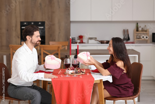 Loving couple exchanging gi...