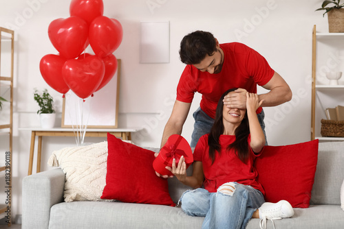 Young man with gift box sur...