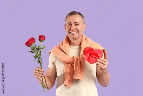 Happy mature man with rose ...