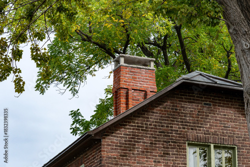 A damaged red brick chimney