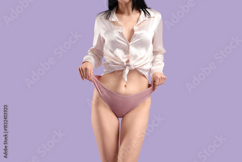 Young woman in pink menstru...