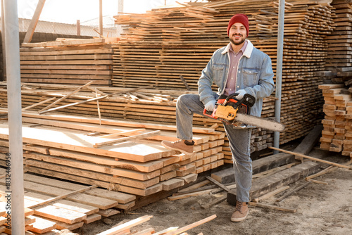 Handsome carpenter with ele...