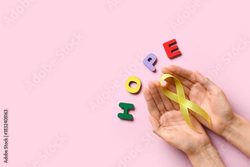 Female hands with yellow ri...