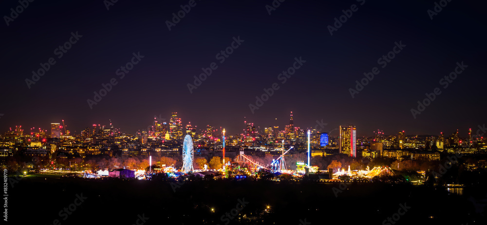 Naklejka premium London Skyline and Christmas Fair in Hyde Park at Twilight