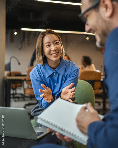 Obraz na płótnie Smiling businesswoman having a job interview in modern office
