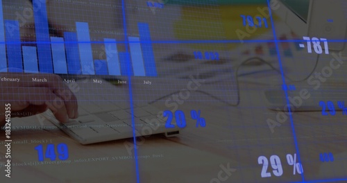 Typing left hand pressing keys on light wood desk, showing white keyboard, mouse, analytics overlay