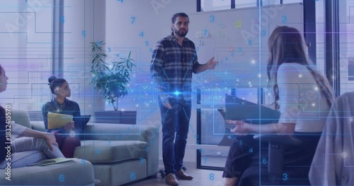 Gesturing presenter in plaid shirt and jeans pointing at whiteboard in lounge with digital overlay