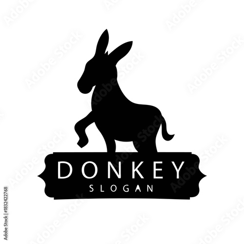 Black silhouette of a donkey with one leg raised, positioned above a banner with the word "DONKEY" and "SLOGAN.".
