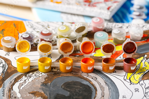 Set of cans with paints on ...