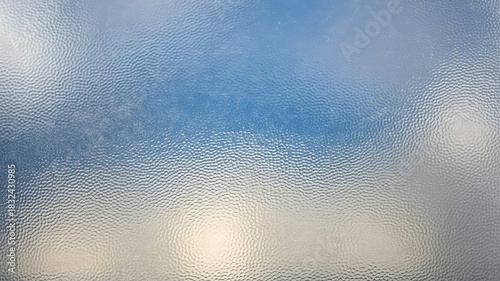 Closeup Textured Ice Surface with Sparkling Light Reflections and Smooth Gradient Transitions Ideal for Winter Design Backgrounds and Cold Temperature Visuals