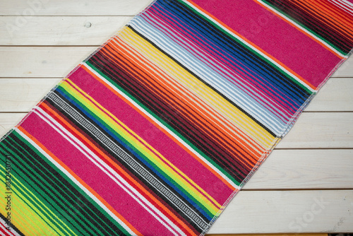 Colorful Mexican blankets in various colors and patterns for cultural and religious concepts.