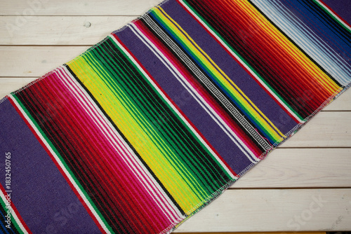 Colorful Mexican blankets in various colors and patterns for cultural and religious concepts.