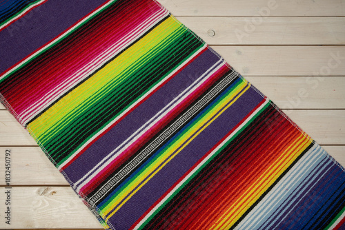 Colorful Mexican blankets in various colors and patterns for cultural and religious concepts.