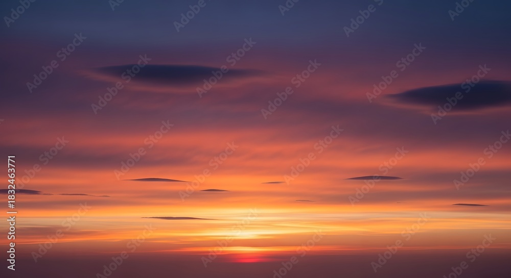 Fototapeta premium Sunset Glow Majestic Sky Painted with Fiery Hues and Clouds at Dusk