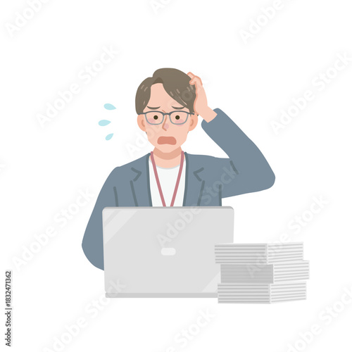 仕事が終わらずに焦るカジュアルな服装のビジネスマン