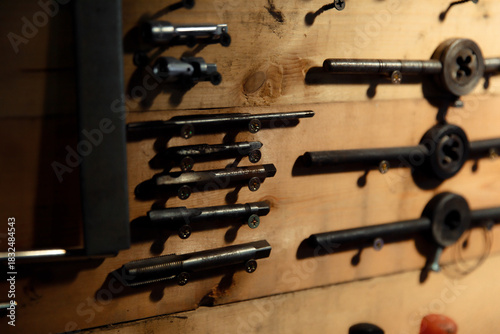 Workbench with hand tools on a wooden base. Garage workstation for classic car repair. Father's Day concept. Workspace organization.