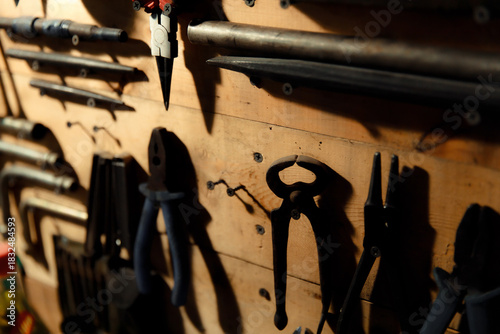 Workbench with hand tools on a wooden base. Garage workstation for classic car repair. Father's Day concept. Workspace organization.