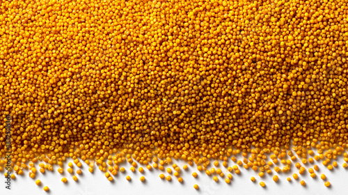 bright yellow raw millet grains forming an organic cereal background with rich natural texture, creating a healthy food concept with warm color and rustic detail
