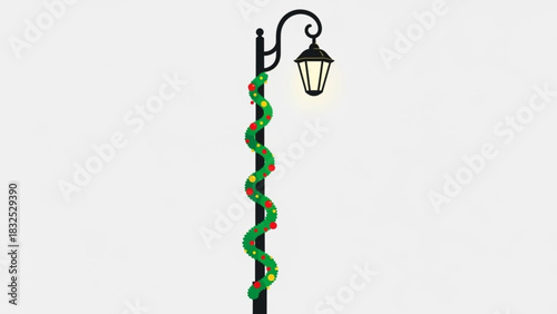 A classic black lamppost is adorned with a festive green garland and red and yellow baubles illuminated by a warm glowing light