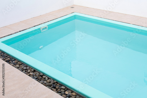 A small swimming pool painted blue